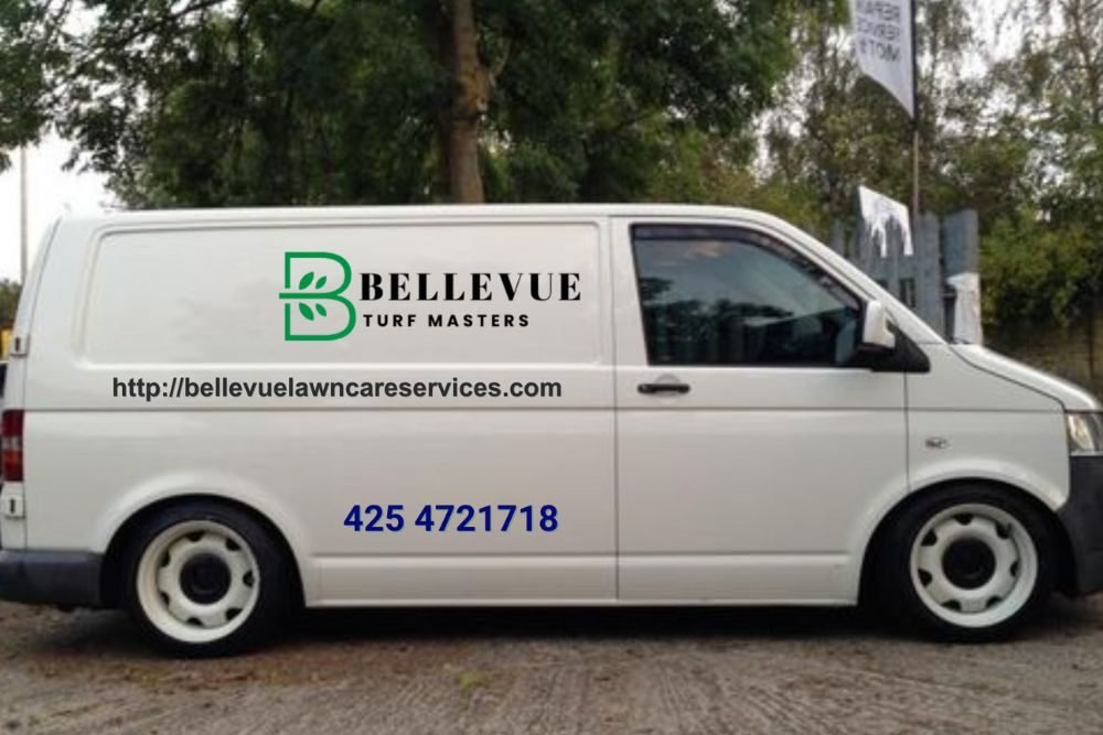A white van featuring the text "Bellevue Turf Masters" written on its exterior.